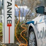 An electric car plugged into a charging station