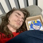 A man asleep in bed at home